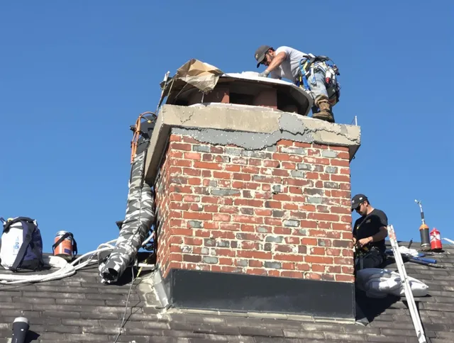 Norwalk Chimney Sweep installing a custom chimney crown in Norwalk, CT
