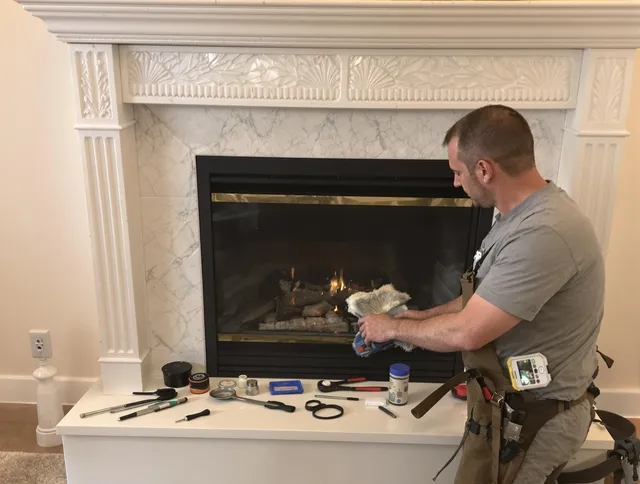 Norwalk Chimney Sweep performing fireplace maintenance in Norwalk, CT